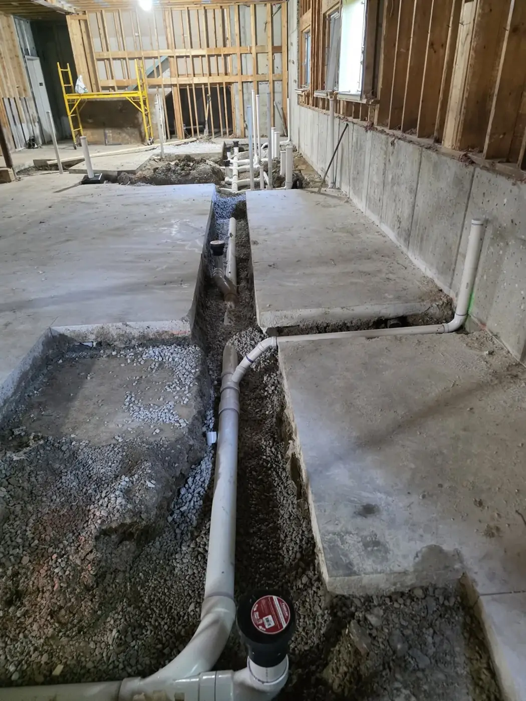 New pipe in a slab trench during an interior renovation