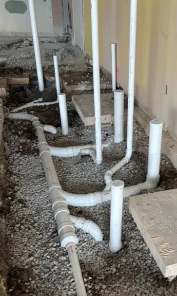 Underground PVC drain rough-in before the slab pour