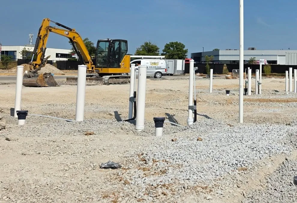 Underground plumbing stubbed up on a commercial building pad