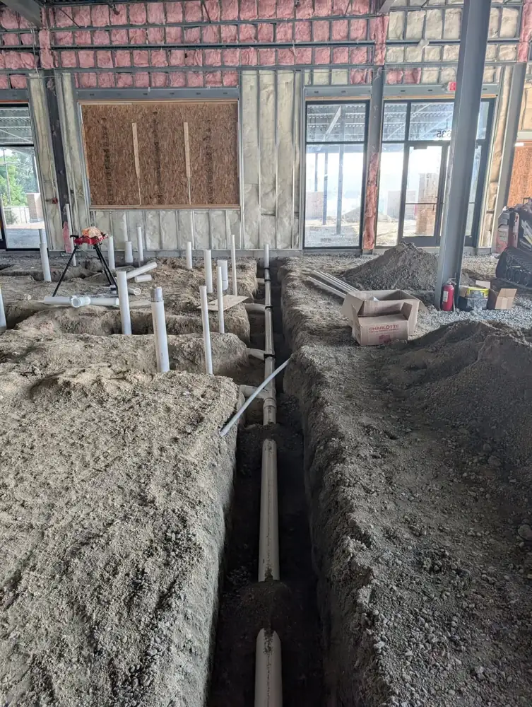 Underground sanitary line in an open trench
