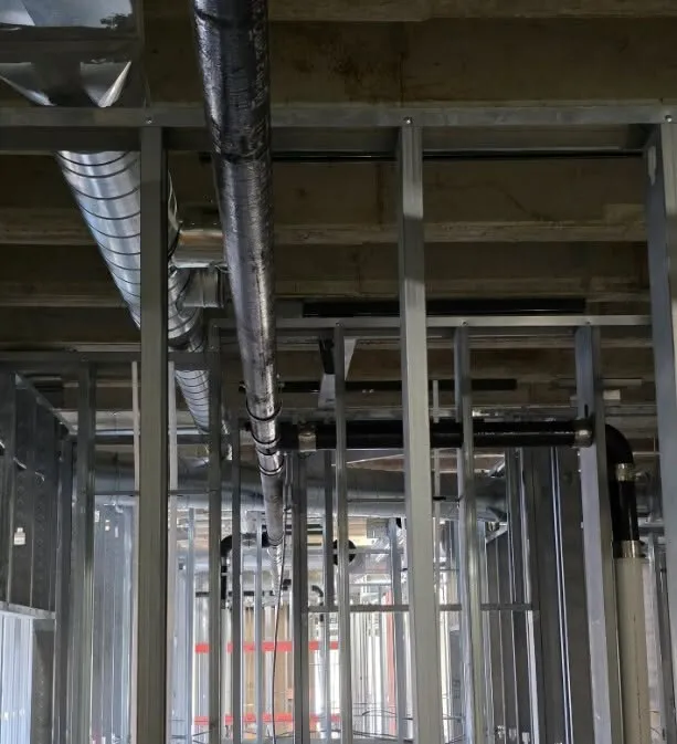 Overhead drain lines in a commercial space