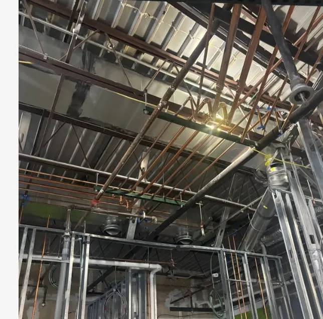 Overhead plumbing in a steel-framed commercial building